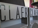 expand Claer black acrylic logo close up